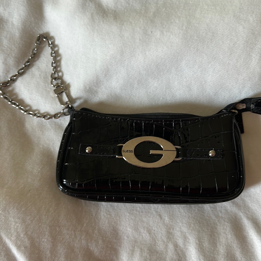 Gently used  GUESS black patent leather wristlet with chain strap